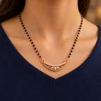 Chandralekha Mangalsutra worn with a navy V-neck professional dress, close-up
