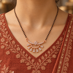 Chandrima Mangalsutra worn with a terracotta Indian kurta, showing its floral crescent and seven accent drops