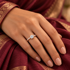 Elysian rose gold plated solitaire-style ring worn on a model's hand with a wine silk saree
