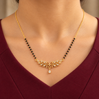 Madhavi floral mangalsutra worn with a professional burgundy dress in a close neckline view
