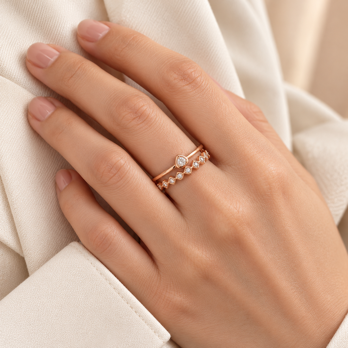 Solstice rose gold plated adjustable ring worn on a model's hand, close-up