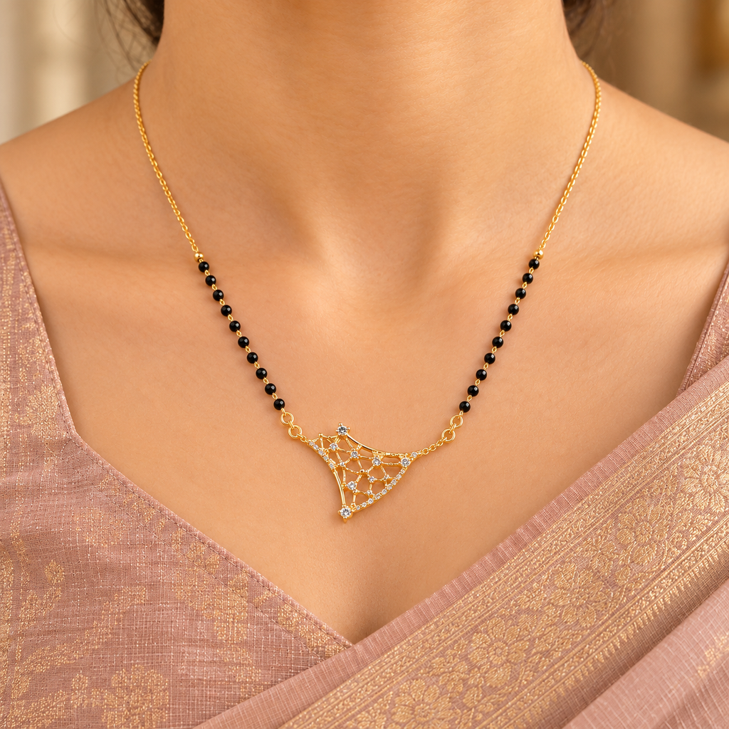 Varnika openwork mangalsutra worn with an elegant rose-beige silk saree in a close neckline view