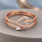 Adeline rose gold plated double-band ring with sideways open heart and small lower accent on a ceramic pedestal