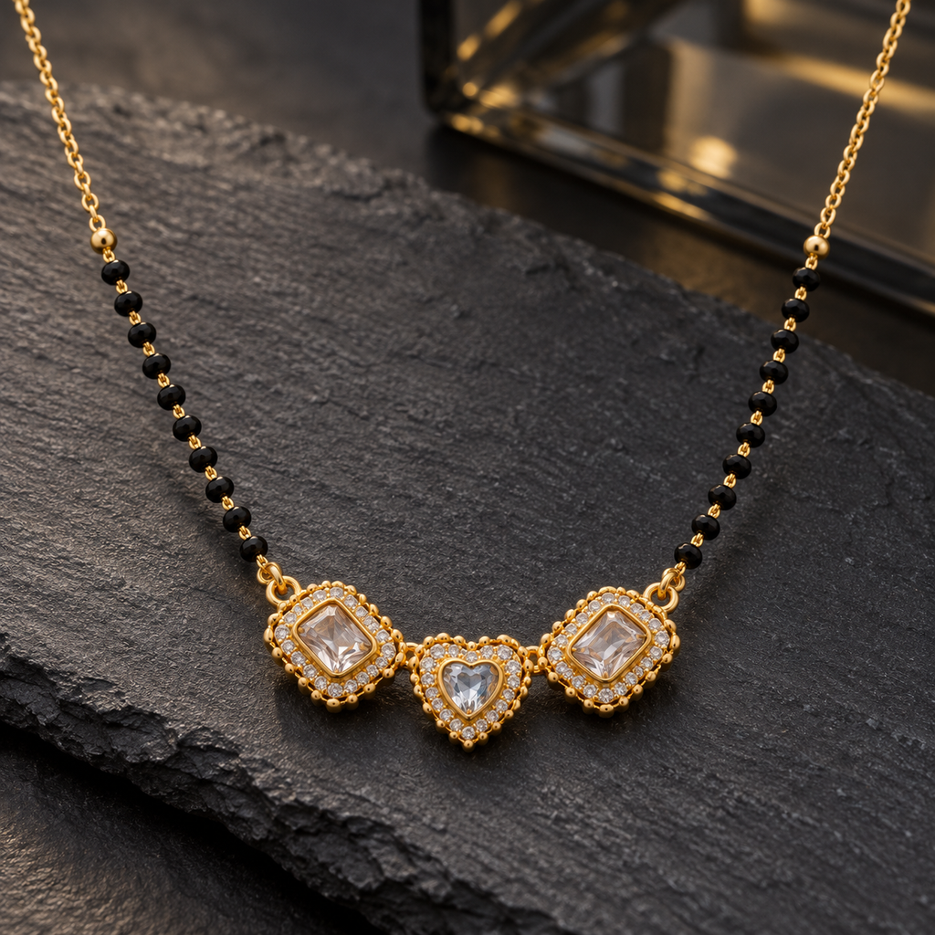 Triveni Mangalsutra with three connected clear-accent motifs photographed at an angle on charcoal slate