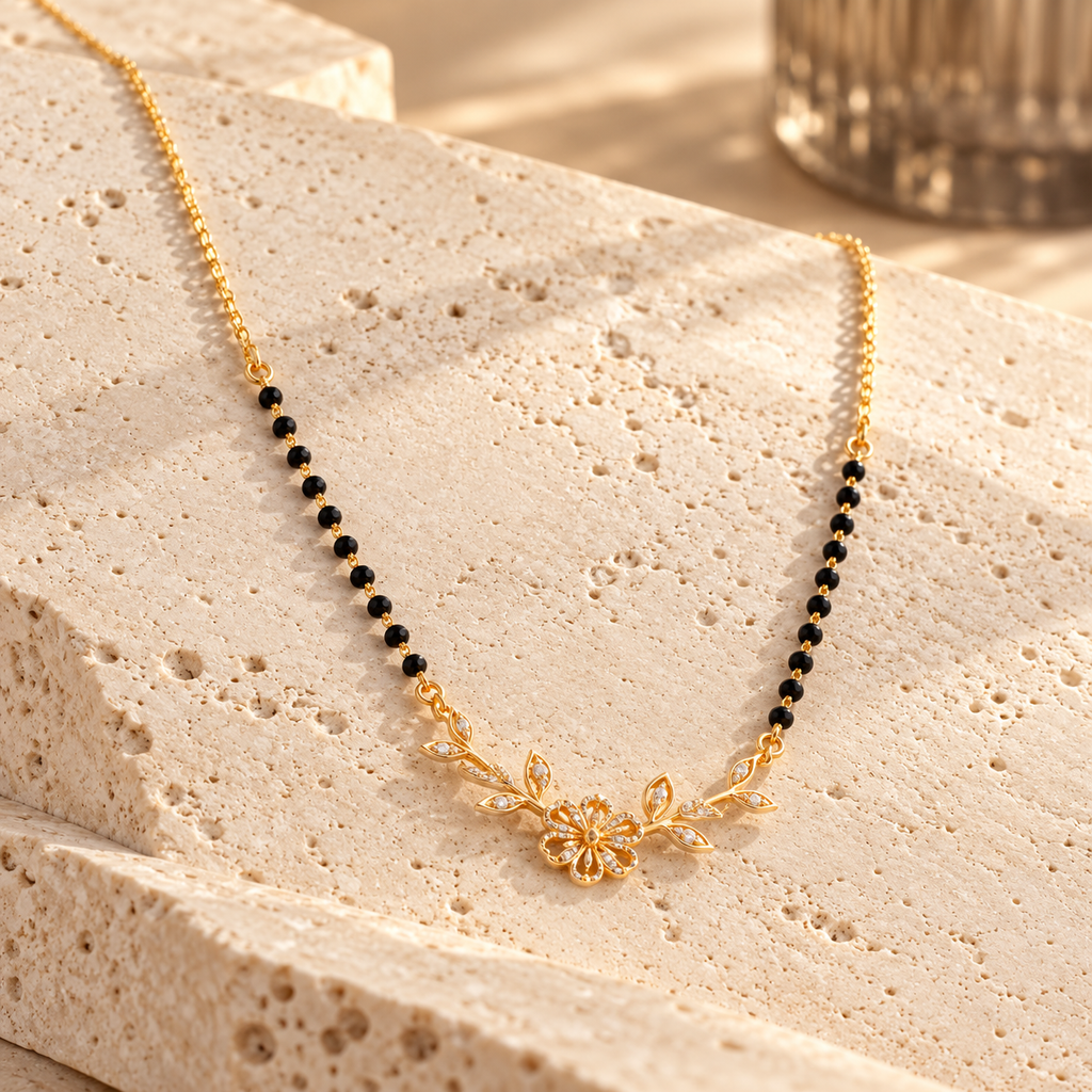 Vallari mangalsutra at an oblique angle on warm travertine stone