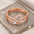 Adeline ring viewed from above on smoky glass with a cream fabric background