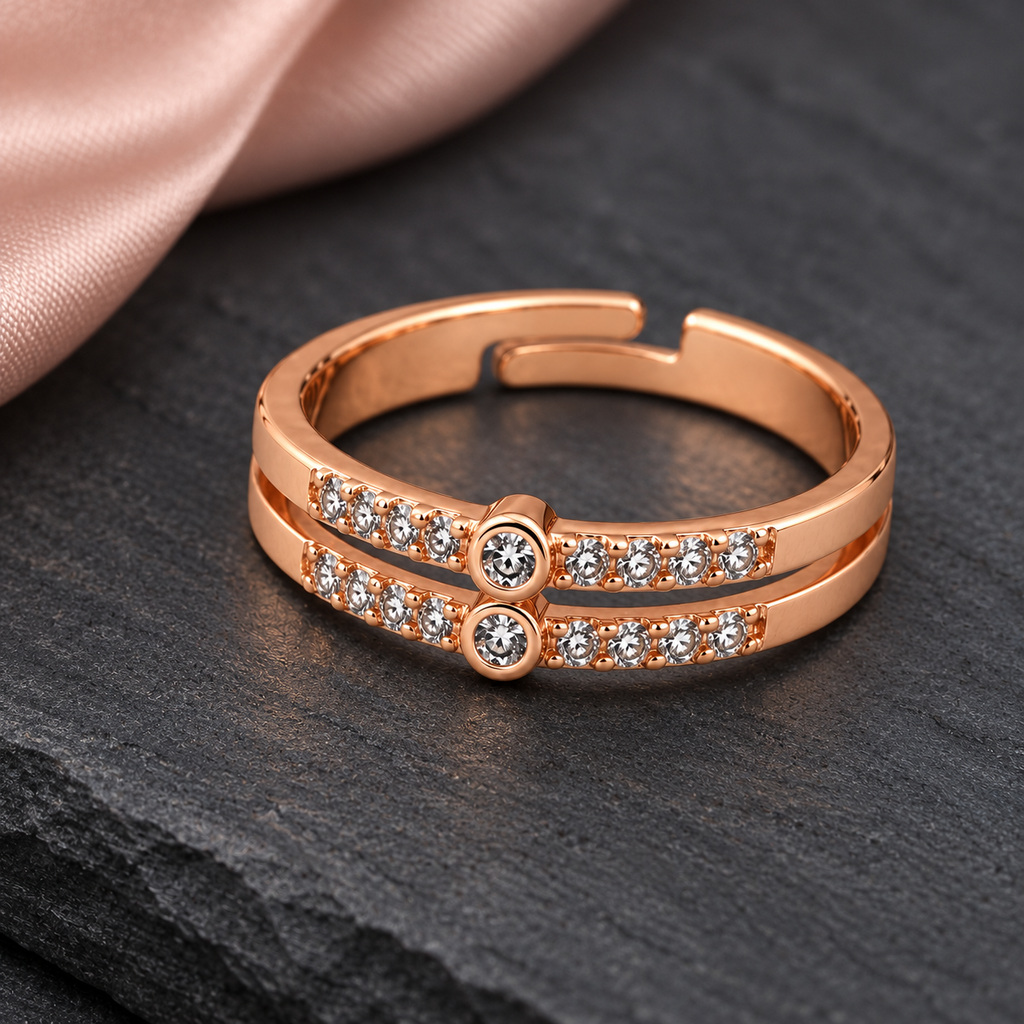 Celeste twin-row ring detail showing the circular centres and adjustable opening on dark slate