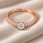 Elysian ring viewed from above on ivory velvet, showing its round centre and adjustable opening