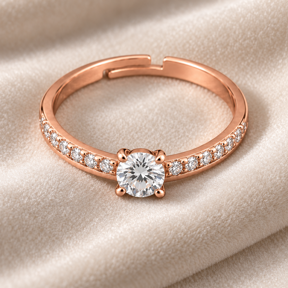 Elysian ring viewed from above on ivory velvet, showing its round centre and adjustable opening
