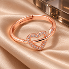 Evermore open-heart ring from a higher angle on champagne satin with a smoked glass accent