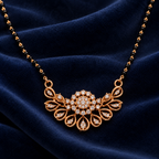 Close detail of Rajvika Mangalsutra floral centre and open teardrop fan on midnight-blue velvet
