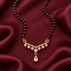 Overhead detail of Saanvika Mangalsutra seven clear round settings, pear drop and black beads on wine silk