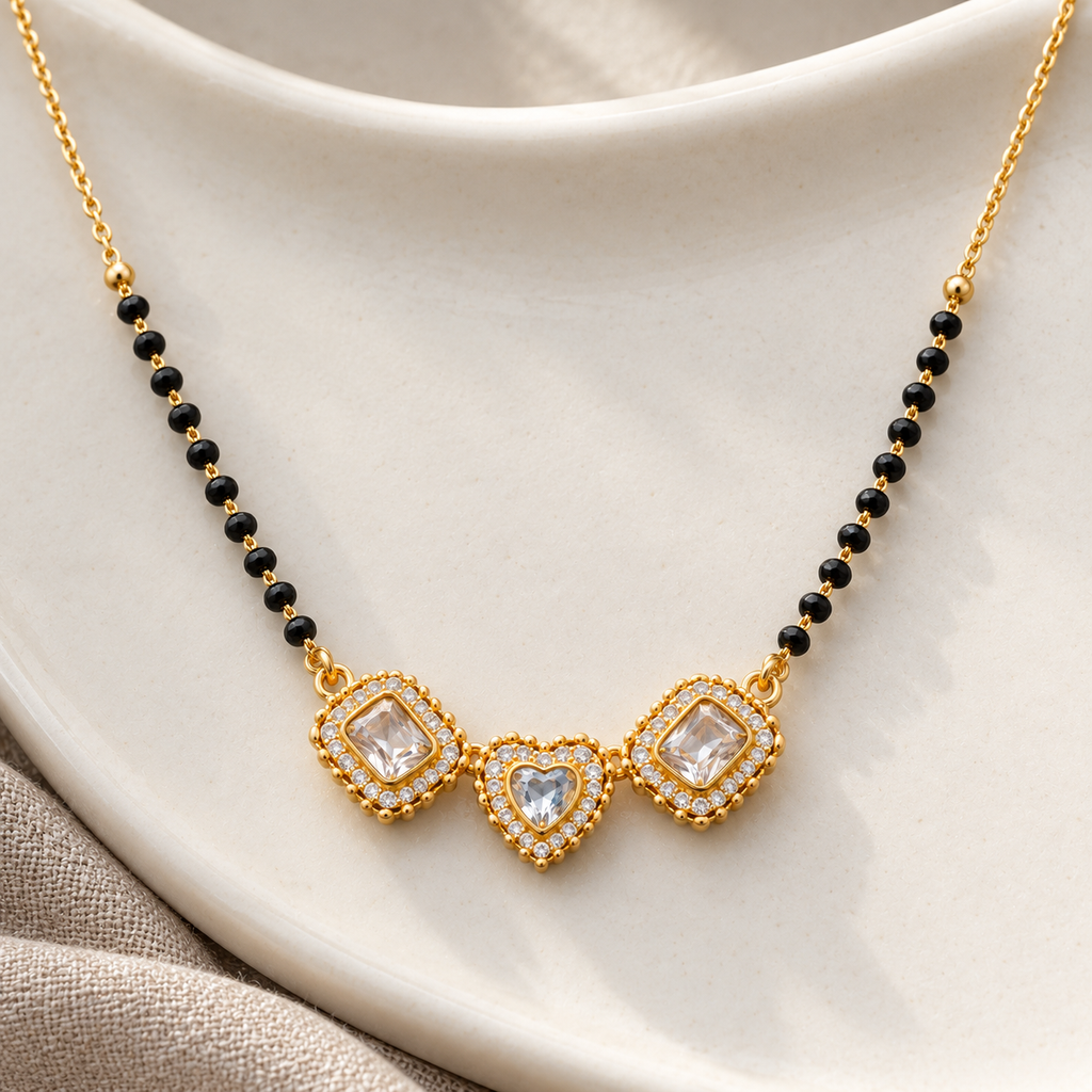 Overhead detail of Triveni Mangalsutra three linked motifs on ivory ceramic
