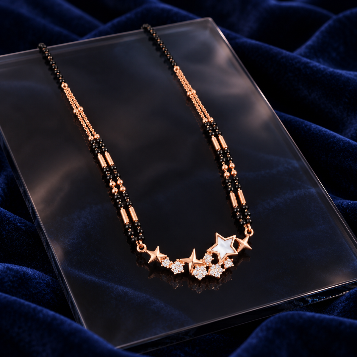 Star mangalsutra on smoky glass with midnight velvet