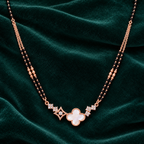 Overhead white clover pendant detail on jade velvet