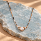 Scallop-shell mangalsutra on pale sea-blue stone