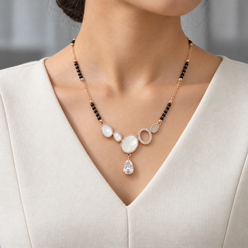 Elara Mangalsutra worn with an ivory woven V-neck dress, showing the pendant and black bead chain.