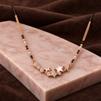 Estoria Mangalsutra angled on pink marble