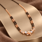 Fiora Mangalsutra on brushed champagne metal at an angle