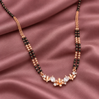 Fiora Mangalsutra in an overhead detail on mauve silk