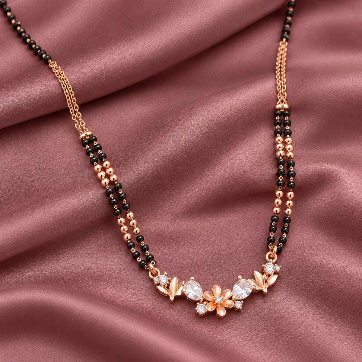Fiora Mangalsutra in an overhead detail on mauve silk