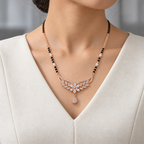 Florence Mangalsutra worn with an ivory woven V-neck dress, showing the pendant and black bead chain.