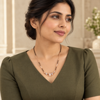 White pear-row mangalsutra styled with a tailored olive dress