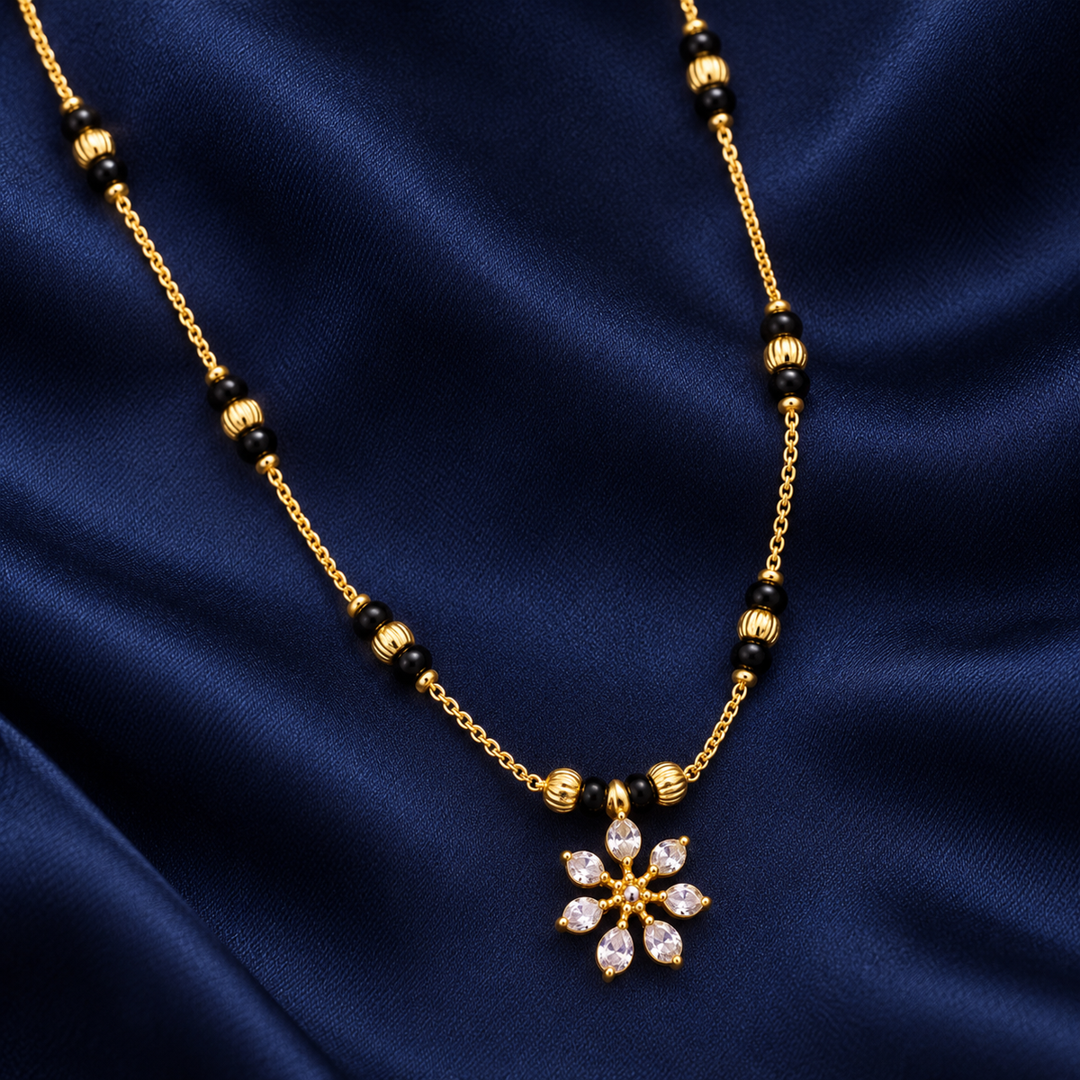 Kairavi Mangalsutra's seven clear petal accents and black bead chain on midnight navy satin