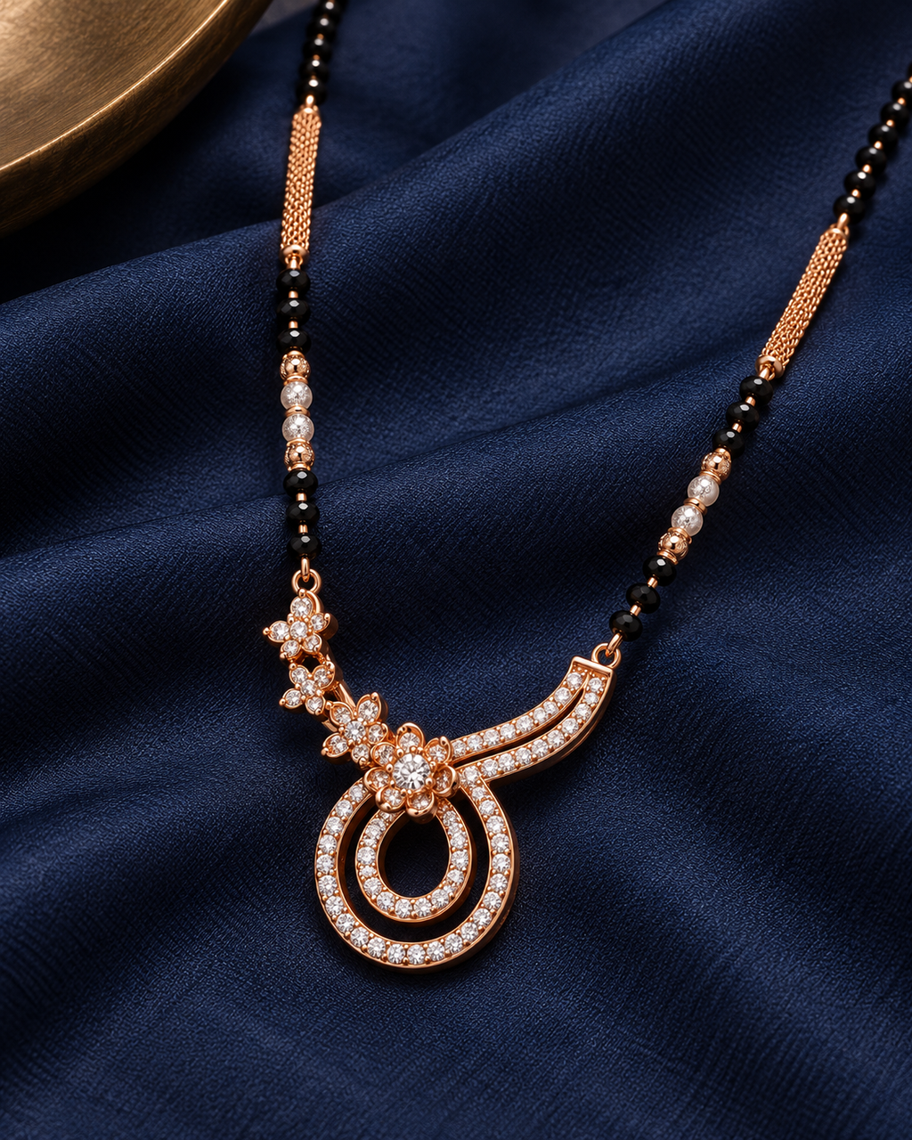 Close detail of Mirelle pendant on midnight blue silk