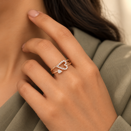 Adeline Ring rose gold plated ring worn snugly on a model hand beside a sage professional dress