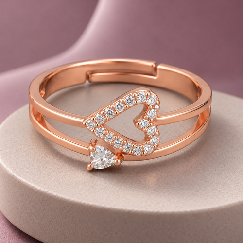 Adeline Ring rose gold plated ring on a pale circular plinth with dusty mauve backdrop