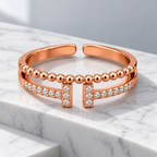 Vivienne Ring on a white marble architectural step