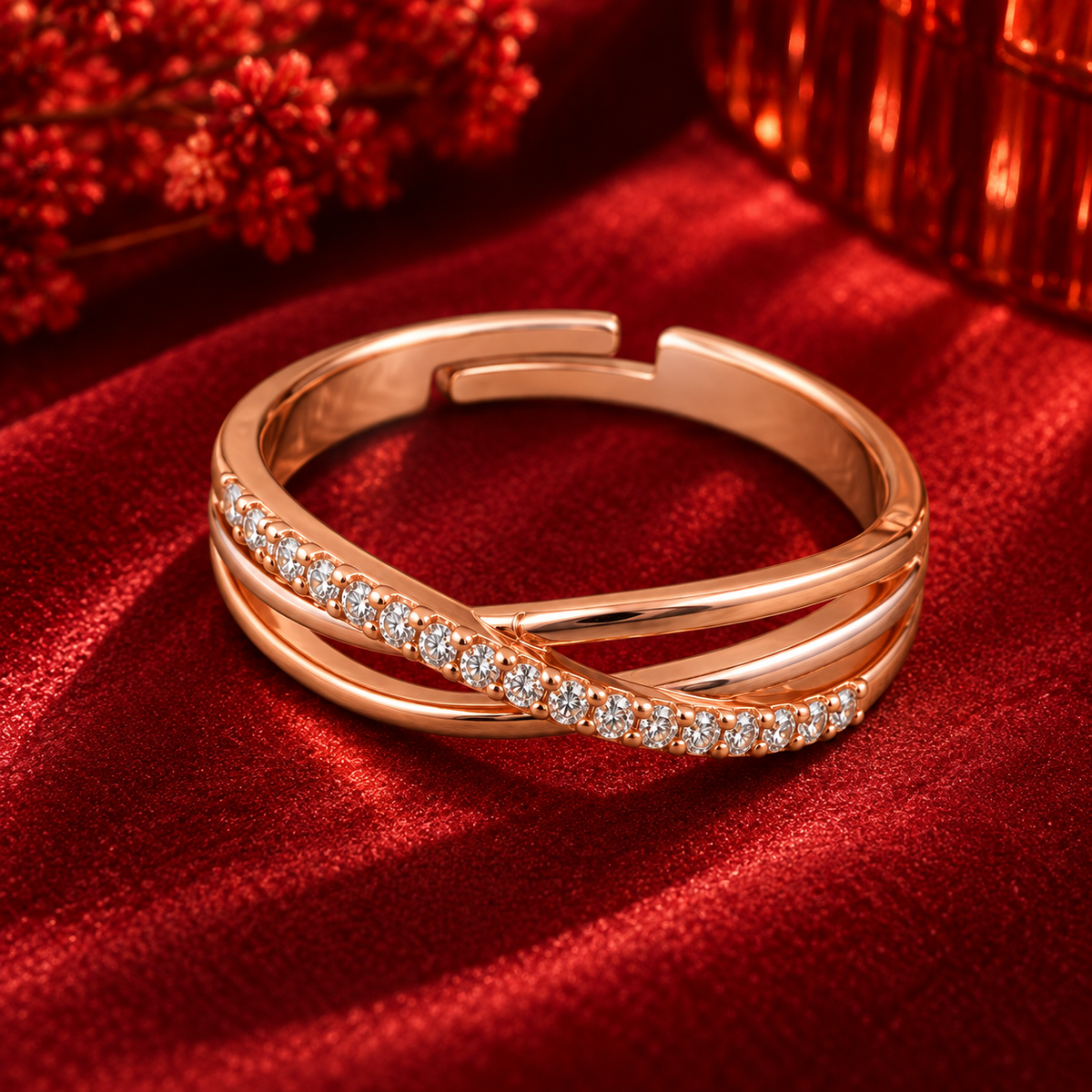 Aurelia Ring rose gold plated ring at a higher angle on crimson velvet with red festive bokeh