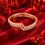 Estelle Ring rose gold plated ring from a higher angle on crimson velvet with red festive bokeh