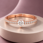 Arabella Ring rose gold plated ring on a pale circular plinth with sculptural dusty mauve backdrop
