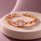 Camille Ring in rose gold, on a pale round plinth against a dusty mauve backdrop