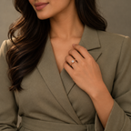 Camille Ring in rose gold, styled on an Indian model wearing tailored sage/taupe professional dress with modest covered chest
