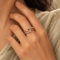 Lucienne Ring in rose gold, worn snugly on a model's hand beside elegant elegant ivory or soft sage saree with proper draping and a modest covered chest