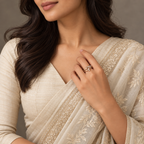 Lucienne Ring in rose gold, styled on an Indian model wearing elegant ivory or soft sage saree with proper draping and a modest covered chest
