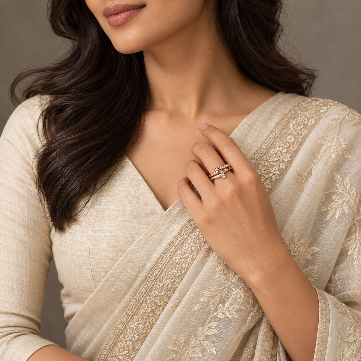 Lucienne Ring in rose gold, styled on an Indian model wearing elegant ivory or soft sage saree with proper draping and a modest covered chest