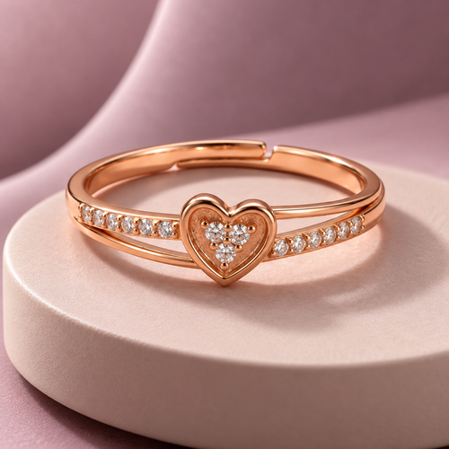 Amorette Ring in rose gold, on a pale round plinth against a dusty mauve backdrop