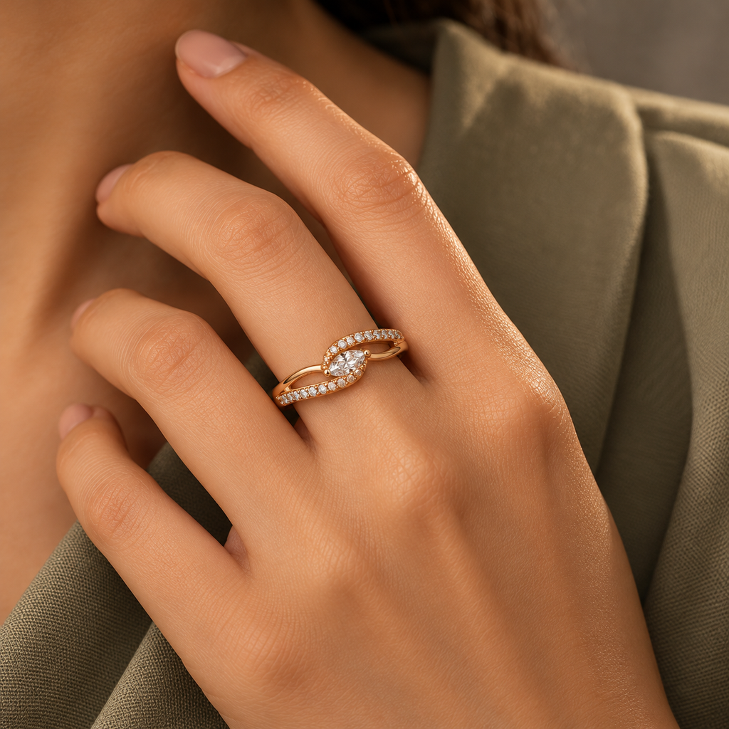 Seraphine Ring in rose gold, worn snugly on a model's hand beside elegant tailored sage/taupe professional dress with modest covered chest