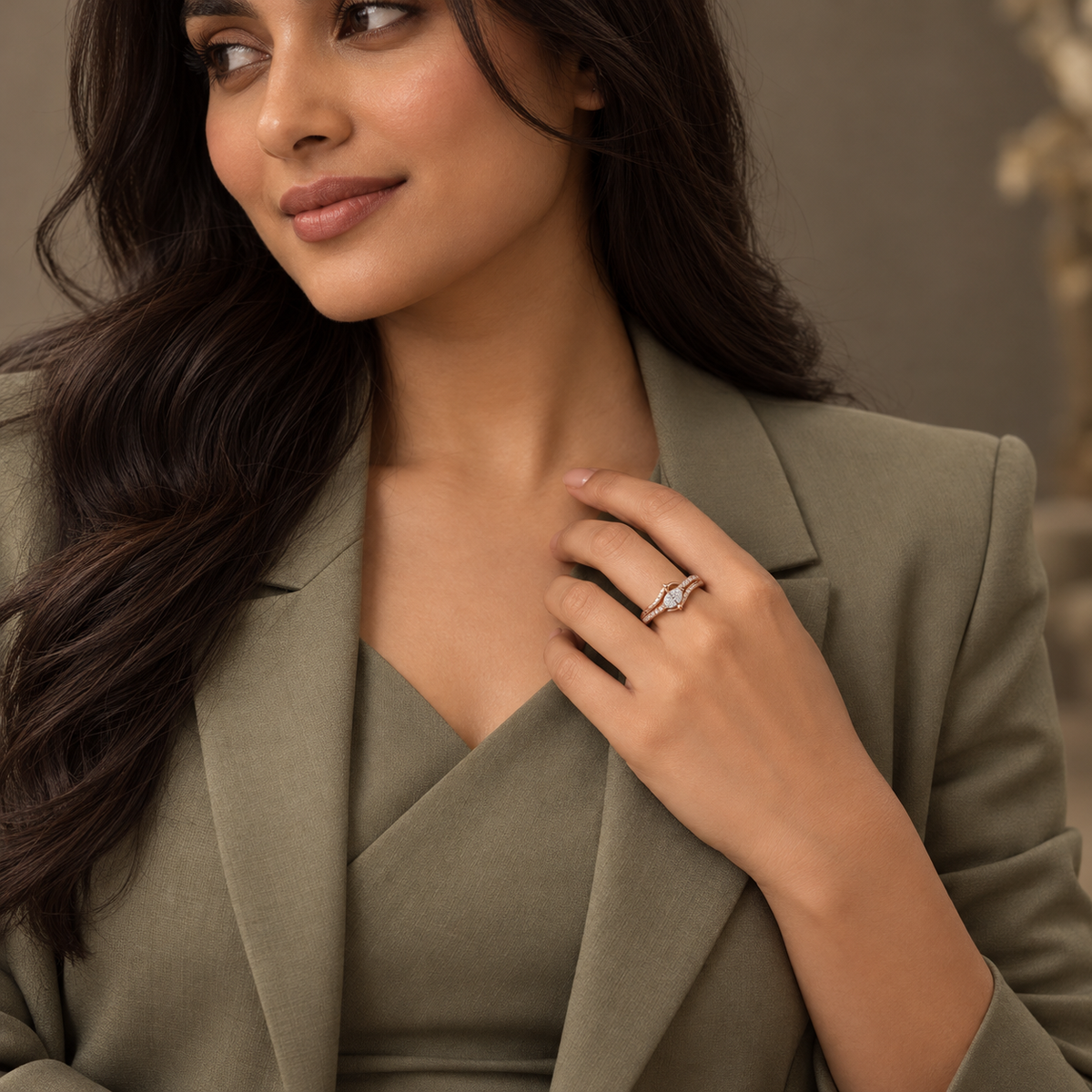 Seraphine Ring in rose gold, styled on an Indian model wearing tailored sage/taupe professional dress with modest covered chest
