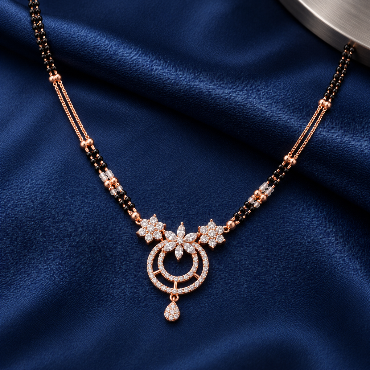 Noelle Mangalsutra in an overhead detail on midnight-blue silk