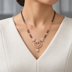 Noelle Mangalsutra worn with an ivory woven V-neck dress, showing the pendant and black bead chain.
