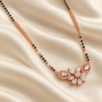 Overhead floral halo pendant detail on warm ivory silk