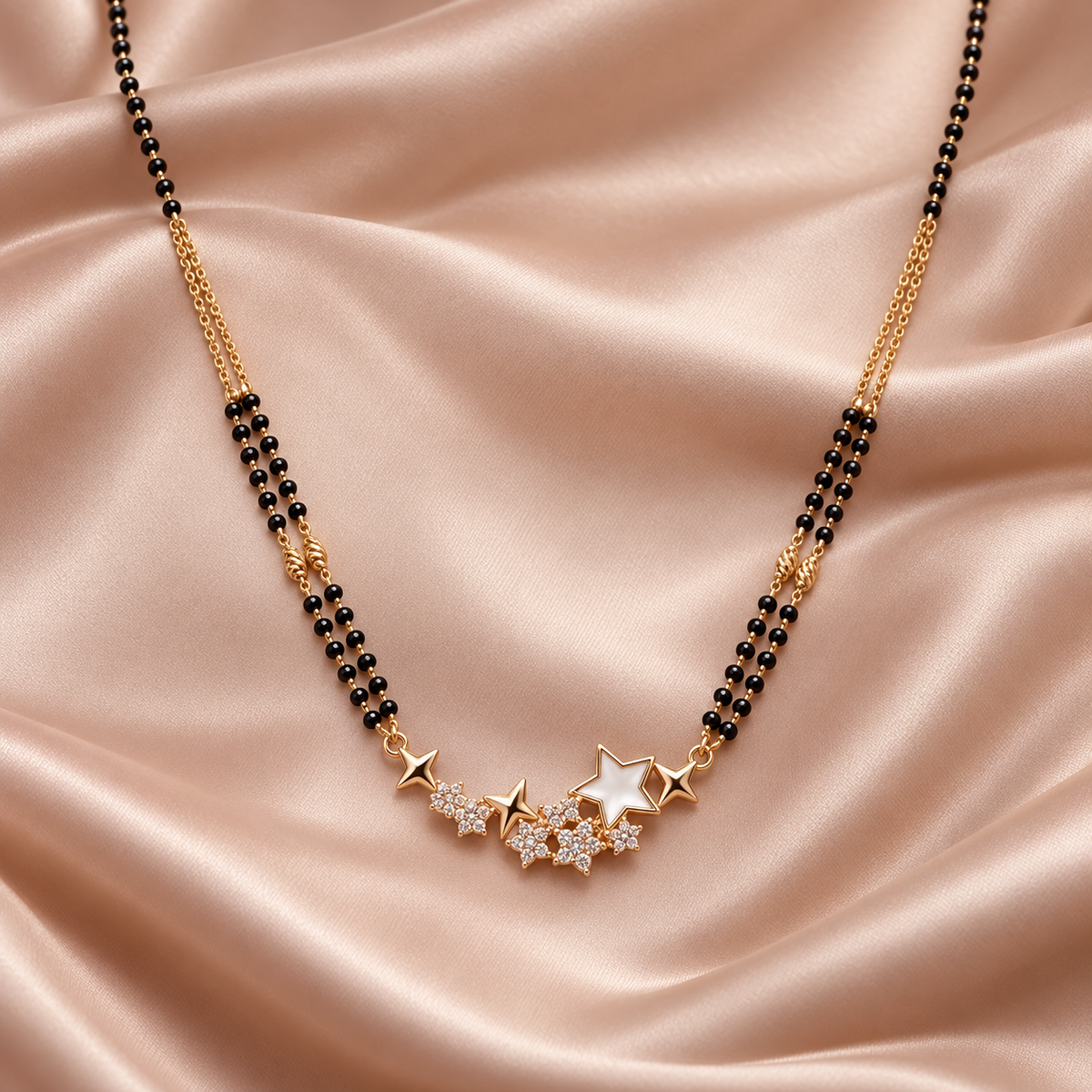 Solara star pendant detail on pale blush silk