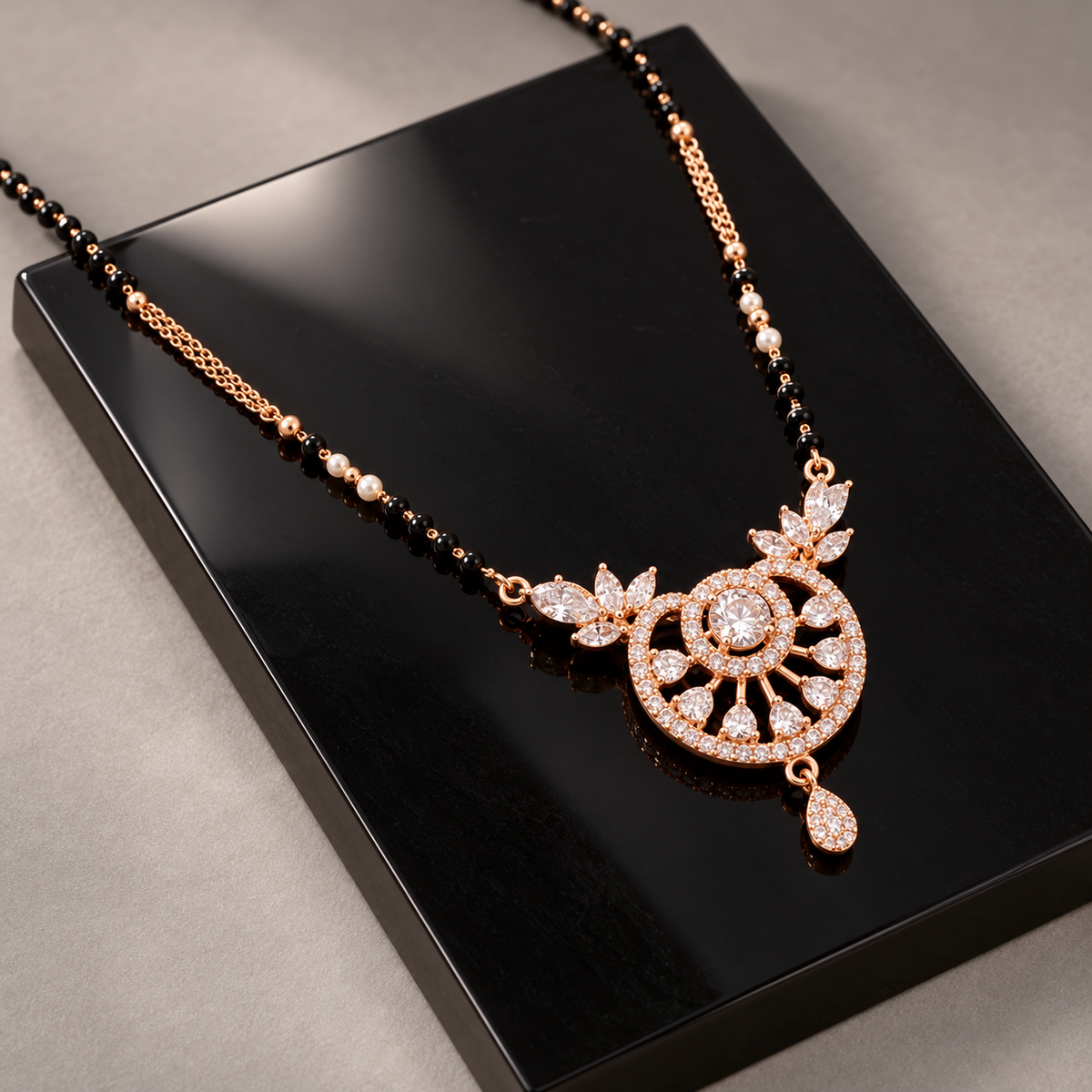 Soleia Mangalsutra at an angle on black onyx