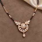 Soleia Mangalsutra in an overhead detail on taupe suede