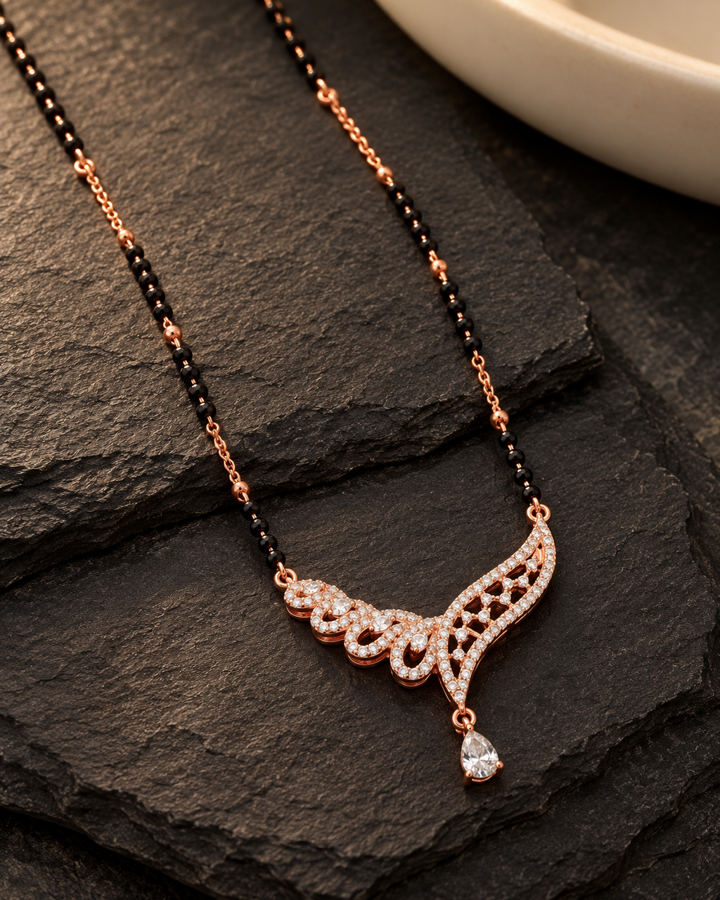 Sylvana Mangalsutra on dark slate at a three-quarter angle